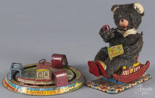 Japanese tin litho battery operated smoking bear, 20th c., 8 3/4'' h., together with a Marx tin litho