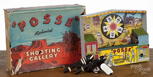 Wyandotte tin litho Posse mechanical shooting gallery, mid 20th c., with the original box, 14 1/2''