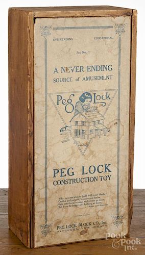 Set of Peg Lock Construction Toy wooden blocks, 20th c., in its original box, 19'' w.