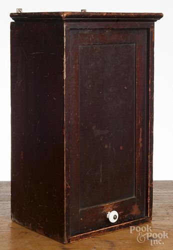 Small Pennsylvania stained poplar hanging cabinet, late 19th c., with a slide lid door, 17 1/4'' h.