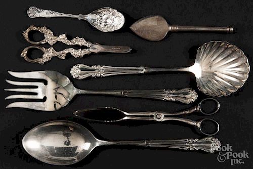 Silver-plated serving utensils.