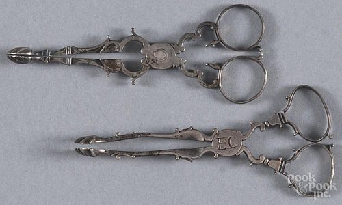 Two Georgian silver sugar tongs, 18th c., one marked with a lion passant and makers mark RM, 2 ozt.