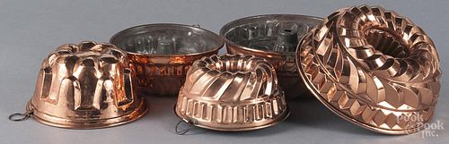 Five copper food molds, largest - 4'' x 9 1/2''.