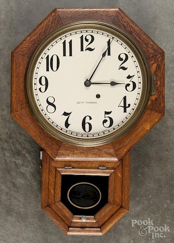 Seth Thomas oak drop octagon wall clock, 24'' h.