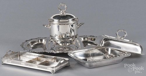 Four silver-plated serving pieces.