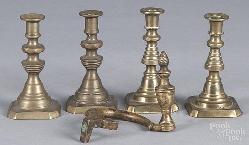 Two pairs of brass tapersticks, ca. 1900, together with a tieback with an urn finial