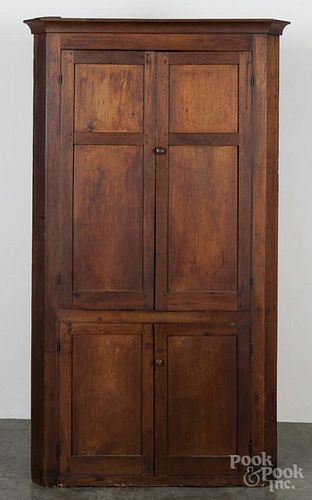 Pennsylvania walnut one-piece corner cupboard, early/mid 19th c., 73 1/2'' h., 38 1/2'' w.