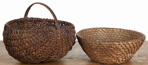 Pennsylvania split oak basket, 19th c., 10'' h., 13'' w., together with a rye straw basket, 4 3/4'' h.