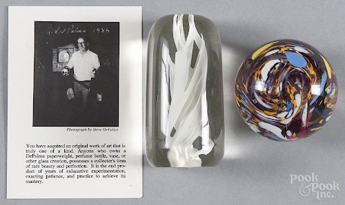 Two Anthony DePalma studio art glass paperweights, to include a cylindrical example, signed