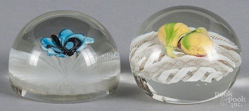 Two glass St. Louis style paperweights, to include a butterfly and pears on latticino grounds