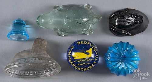 Four figural glass paperweights, to include a lion, a frog, a turtle, and a pumpkin