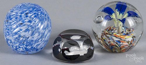 Three art glass paperweights, 20th c., to include a swirled Pairpoint paperweight, 3 1/4'' dia.