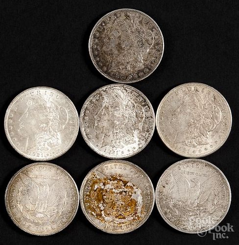Seven Morgan silver dollars, to include 1880 O, 1886, 1898, 1900, and 1921, VF-UNC, tarnished.