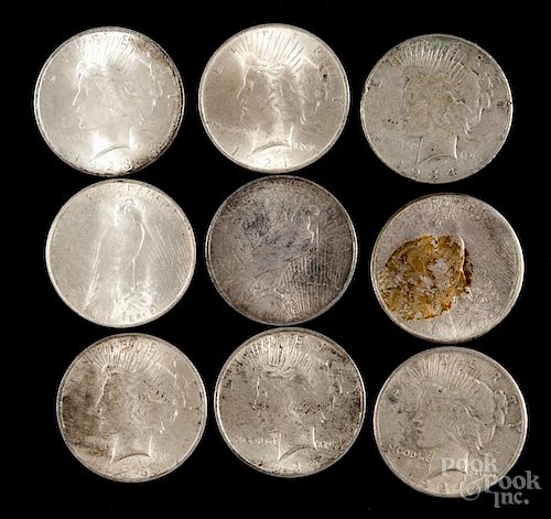 Nine silver Peace dollars, to include 1922, 1923, 1924, 1925, and 1934, average circulated.