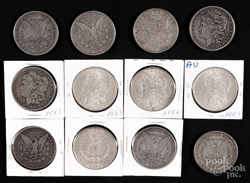 Twelve Morgan silver dollars, to include two 1882, two 1882 O, five 1883, and three 1883 O, G-AU.