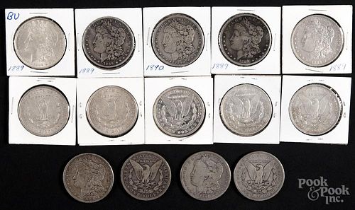Fourteen Morgan silver dollars, to include an 1887, an 1887 O, three 1889, four 1889 O, two 1890