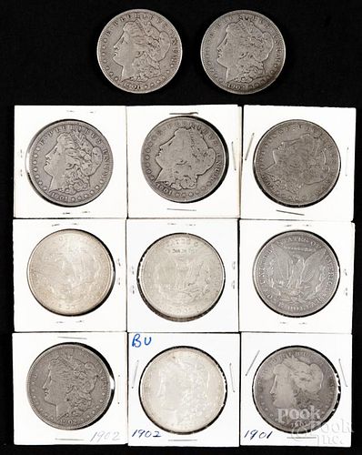 Eleven Morgan silver dollars, to include three 1901 O, two 1901 S, two 1902, and four 1902 O, G-AU.