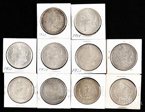Ten Morgan silver dollars, to include a 1921 D and a 1921 S, VF-AU.
