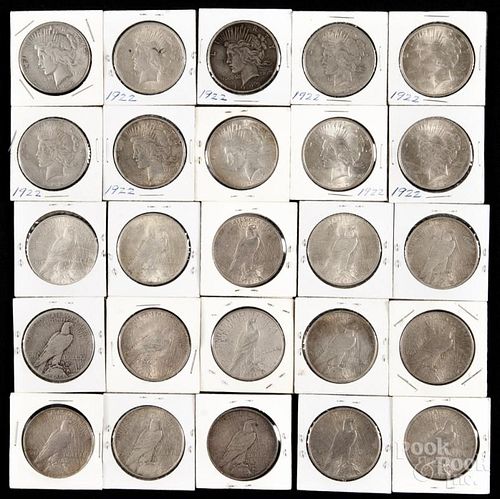 Twenty-five silver Peace dollars, to include a 1922, a 1922 D, and a 1922 S