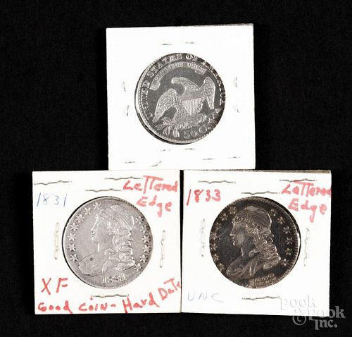 Three Capped Bust silver half dollars, to include an 1829, an 1831, and an 1833, all XF.