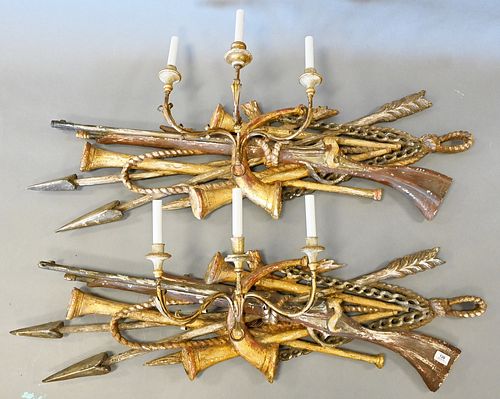Pair of Giltwood and Gesso Wall Sconces, each in the form of a rifle, horn, arows and rope, having three arms with electrified candle holders, height 