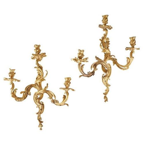 A PAIR OF 19TH CENTURY FRENCH GILT BRONZE ROCOCO STYLE THREE LIGHT WALL APPLIQUES