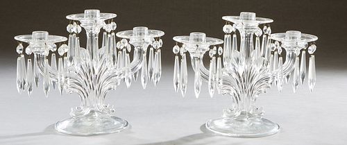 Pair of American Pressed Glass Three Light Candelabra, 20th c., on swirled supports with glass bobeches hung with button and spear prisms, on a domed 