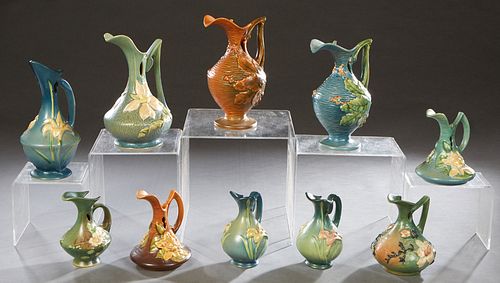 Group of Ten Pieces of Roseville Pottery, consisting of 22-6, Zephyr Lily Ewer; 981, White Rose Ewer; 23-10 Zephyr Lily Ewer; 2-10 Bushberry Ewer;  17