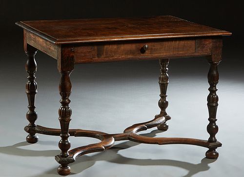 French Provincial Henri II Style Writing Table, late 19th c., the sloping edge rectangular top over a single frieze drawer on turned tapered reeded le