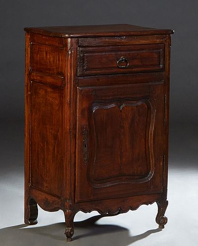 French Provincial Louis XV Style Carved Oak Confiturier, 19th c., the stepped rounded corner and edge top over a frieze drawer above a fielded panel c