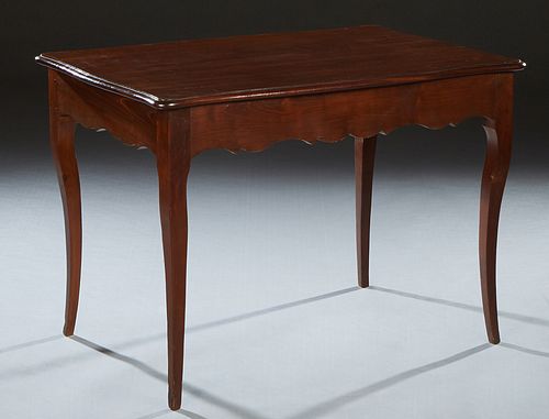 French Louis XV Style Carved Walnut Occasional Table, 20th c., the rounded edge tortoise top over a wide scalloped skirt, on tapered square cabriole l