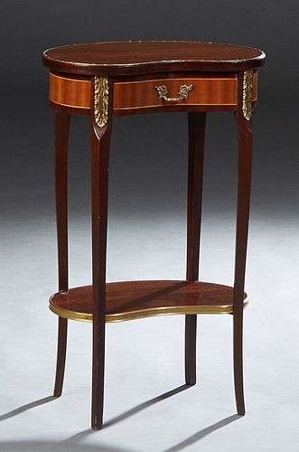 French Ormolu Mounted Carved Carved Cherry Louis XV Style Kidney Shaped Nightstand, 20th c., with a concave frieze drawer, on cabriole legs joined by 