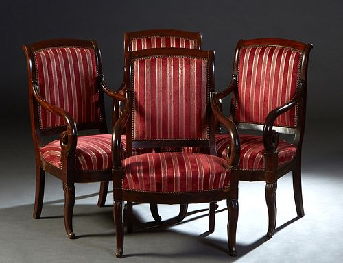 Set of Four Louis Philippe Carved Walnut Fauteuils, 19th c., the canted arched back over scrolled arms and a bowed seat on cabriole legs, in pink and 