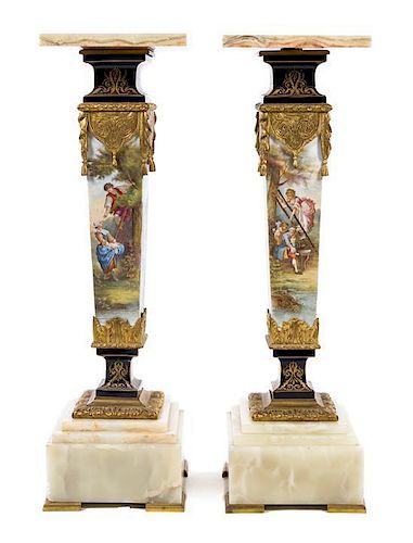 A Pair of Sevres Gilt Metal Mounted Porcelain Pedestals Height 41 3/4 inches.