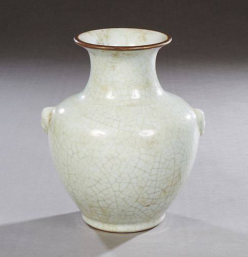 Chinese Crackleware Pale Green Baluster Vase, 20th c., with integral Foo dog relief handles, H.- 10 3/4 in., W.- 9 1/4 in., D.- 8 1/2 in.