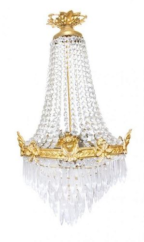 A Louis XVI Style Gilt Metal Eight-Light Chandelier Height 29 1/2 inches.