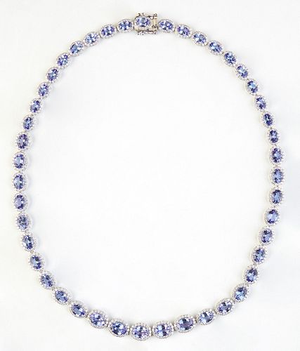14K White Gold Link Necklace, each of the 45 oval links with a graduated oval tanzanite atop a border of small round diamonds, total tanzanite wt.- 32