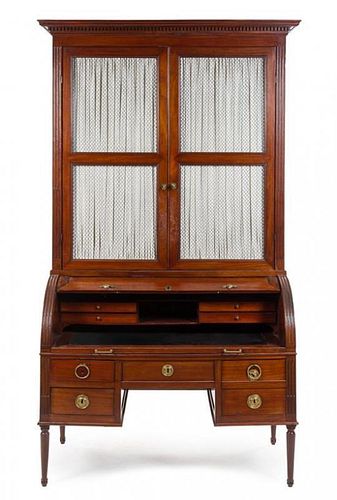 A Directoire Style Mahogany Cylinder Bookcase Height 95 1/2 x width 52 1/2 x depth 26 inches.