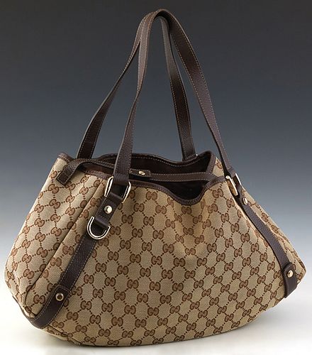 Gucci Abbey Hobo Diagonal Line, in beige monogrammed canvas with dark brown leather accents and gold hardware, opening to a side zip pocket, accompani
