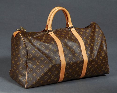 Louis Vuitton Keepall 50 Travel Bag, in a brown monogram coated canvas, with vachetta leather and golden brass hardware, with a brown canvas lined int