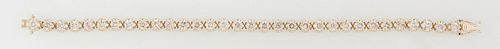 14K Yellow Gold Tennis Bracelet, each of the 32 links with a round diamond, total diamond wt.- 7.35 ct., L- 7 1/4 in., with appraisal.