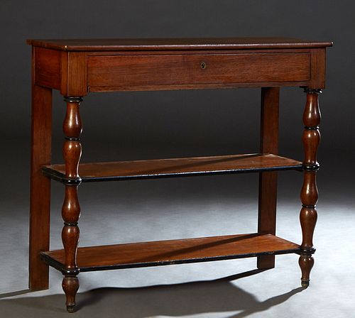 French Provincial Carved Walnut Serving Trolley, c. 1870, the rectangular top over a long frieze drawer, on large bobbin turned supports to a center a