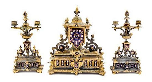 A French Gilt Metal and Enamel Clock Garniture Height of clock 15 1/4 x width 12 7/8 x depth 6 1/4 inches.