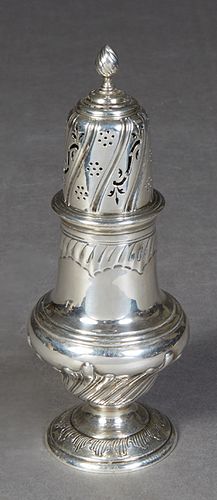 Sterling Sugar Shaker, London, 1888, by Charles Stuart Harris, fully hallmarked, with repousse decoration on a knopped circular base, H.- 8 1/2 in., D