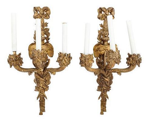 A Pair of Continental Gilt Bronze Three-Light Sconces Height 21 1/2 inches.