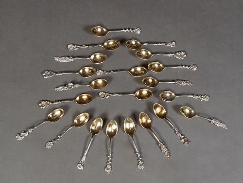 Mardi Gras- Group of Twenty-one Ball Favors, in the form of sterling demitasse spoons with gilt washed bowls and relief floral handles, by Reed and Ba