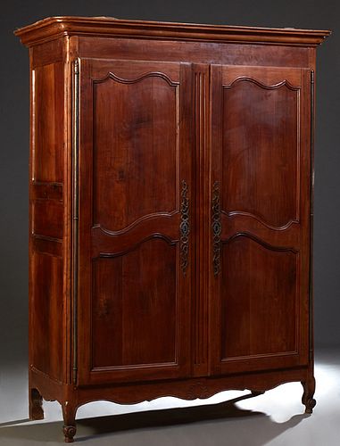 French Carved Cherry Louis XV Style Armoire, early 19th c., the stepped  rounded corner crown over double two panel doors with long iron fiche  hinges a sold at auction on 19th March