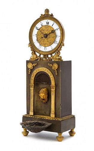 A Continental Gilt and Patinated Bronze Automaton Clock Height 13 inches.