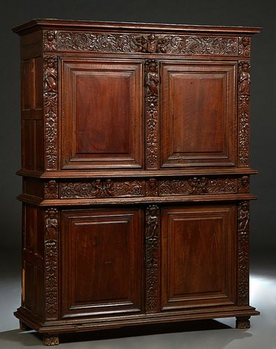 French Henri II Carved Walnut Buffat a Deux Corps, c. 1880, the stepped crown over a figural and floral carved frieze above double fielded panel cupbo