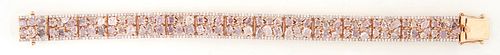 Lady's 18K Rose Gold Link Bracelet, each of the 15 rectangular links mounted with six multi-toned pink diamonds, of oval, pear, and radiant shapes, wi